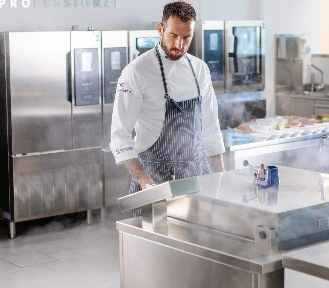 chef cooking in electrolux professional equipment